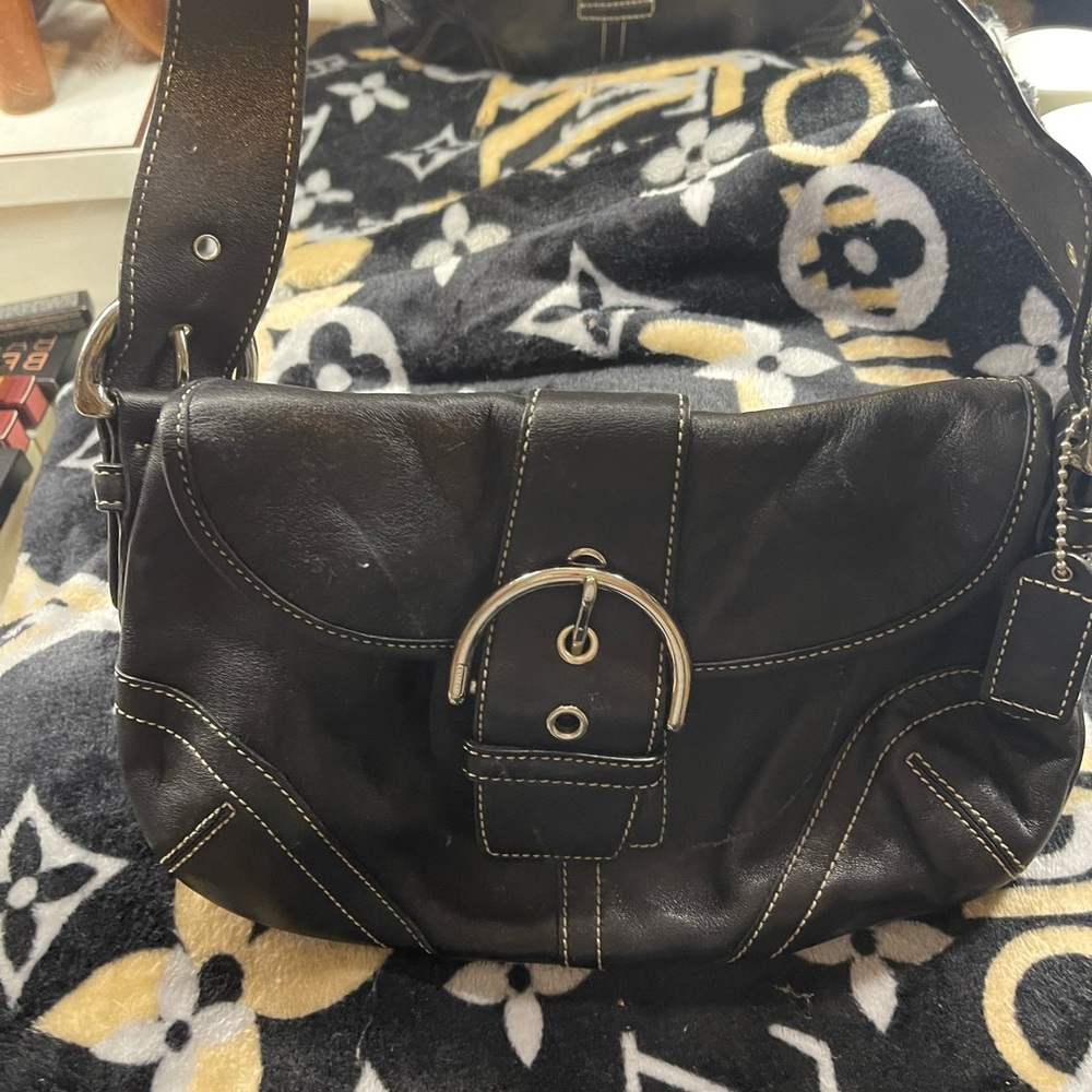 Black leather Coach shoulder bag silver buckle . Leathe. Great condition